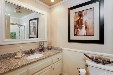 Hallway bathroom offering granite counter tops.