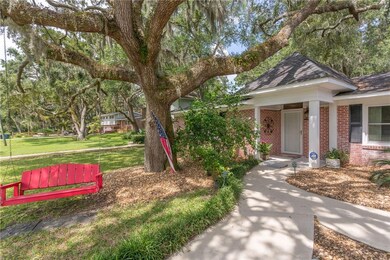 Large oak tree in front and 2 in backyard.