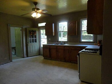 Exterior Front. kitchen looking to door to covered