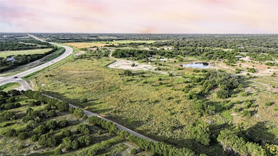 Aerial view of property and surrounding area with a large body of water