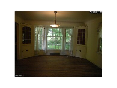 Charming corner cabinets and a huge bay window ove