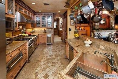 Gourmet kitchen has Stainlees  appliances  with co