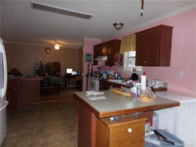 Kitchen looking towards adjacent dining area.