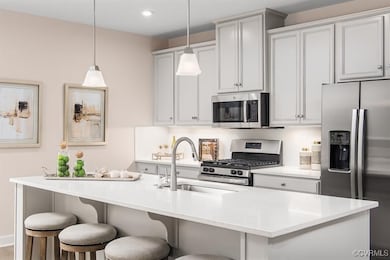 Kitchen featuring a kitchen bar, tasteful backspla