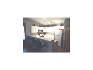 Kitchen. Efficient crisp white kitchen with large 