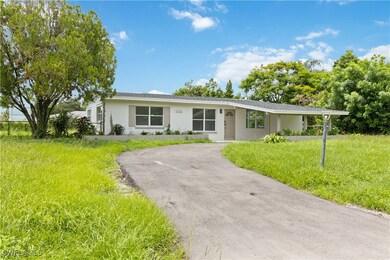 Single story home with a front yard