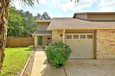 Townhome / multi-family property with stone sidin