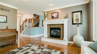 The fireplace and mantel anchor the space with war