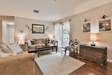 Nice sized living room with sliders to patio.  Ope