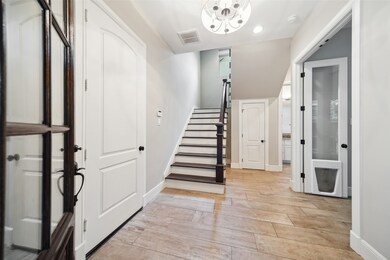 This photo shows a bright, welcoming entryway with