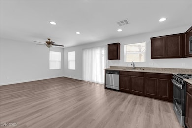 Kitchen with stainless steel dishwasher, range wit