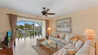 Tiled living room featuring ceiling fan