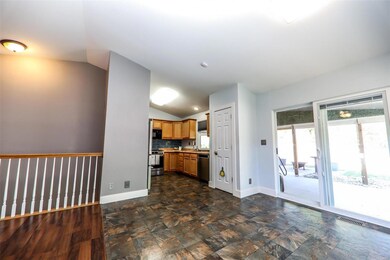 Living Room opens to Dining area and Kitchen.
