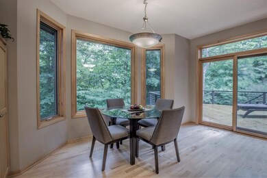 Adjacent dinette offers tranquil views.