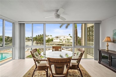 Sunroom / solarium with a water view