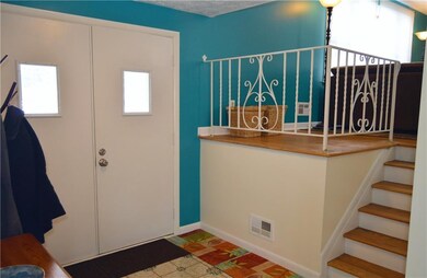 foyer  stairs lead to livingroom, same floor is on