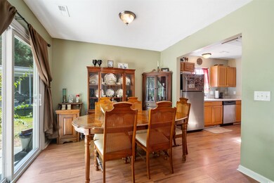 Dining space with light hardwood / wood-style floo