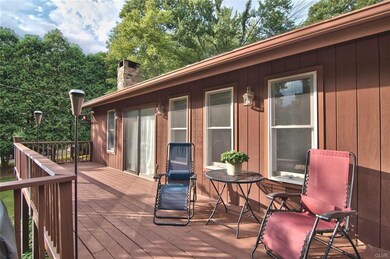 The front deck runs the length of the house and me