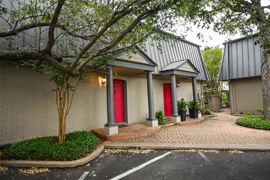 View of front facade featuring brick siding, a st