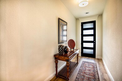 Entryway featuring hardwood / wood-style floors, b