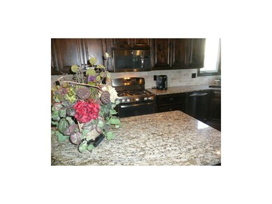 Gas range in background compliments other stainles
