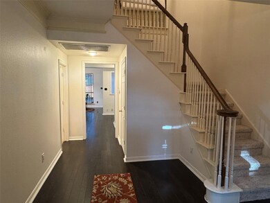 The impressive Entry Foyer leads you to the kitchen or Upstairs