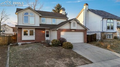 Traditional-style house with a garage, concrete dr