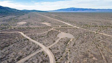View of rural area with a mountainous background and a desert landscape