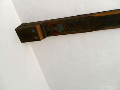 Original exposed wood beams with hand painted desi