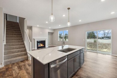 Imagine your living room with 9' ceiling flooded with light streaming in through the large windows and sliding doors. Fireplace with stone surround and painted mantle.