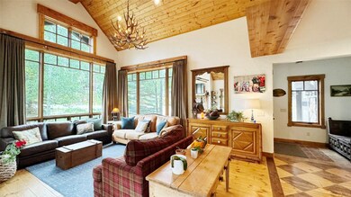 Living room featuring hard wood floors, high vault