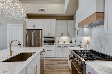 Kitchen with appliances with stainless steel finis