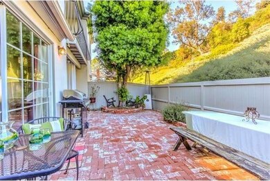 Beautiful back patio that opens to a park setting.