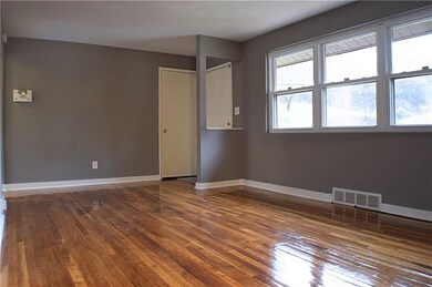 View of entry and living room from hallway.