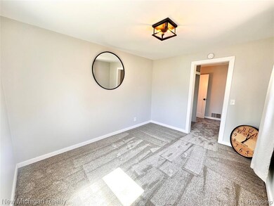 Unfurnished room with carpet floors and baseboards