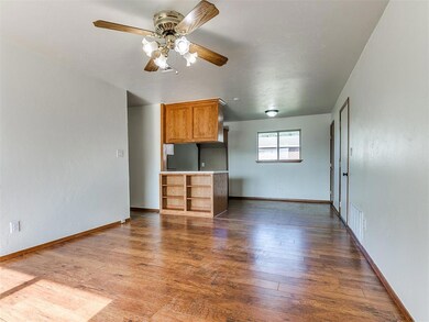 Unfurnished living room featuring hardwood / wood-