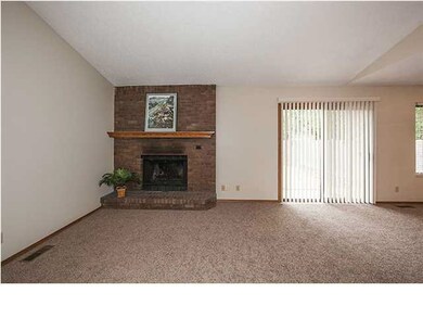 Brick wood burning fireplace in living room