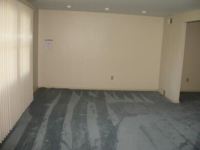 Large Living room with triple windows, recessed li