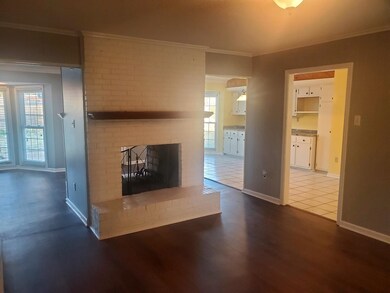 Unfurnished living room with crown molding, a weal