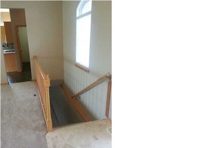STAIRWAY OFF FRONT DOOR TO LOWER LEVEL