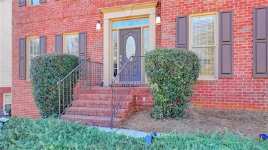 Property entrance featuring brick siding