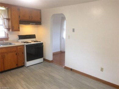 The kitchen has newer flooring.