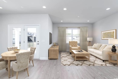 Living area featuring recessed lighting, baseboard