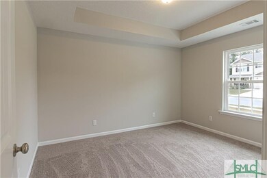front bedroom with trey ceiling