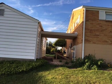 Roof connects basement entrance to garage.