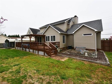 View of back yard with generous wood deck