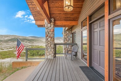 Wooden terrace featuring a mountain view