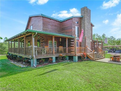 Rear view of property with a lawn