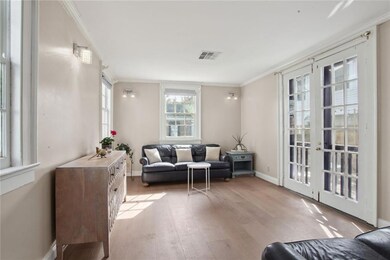 Living room with double doors to the courtyard.