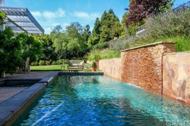 Beautiful salt water pool with spa and waterfall.